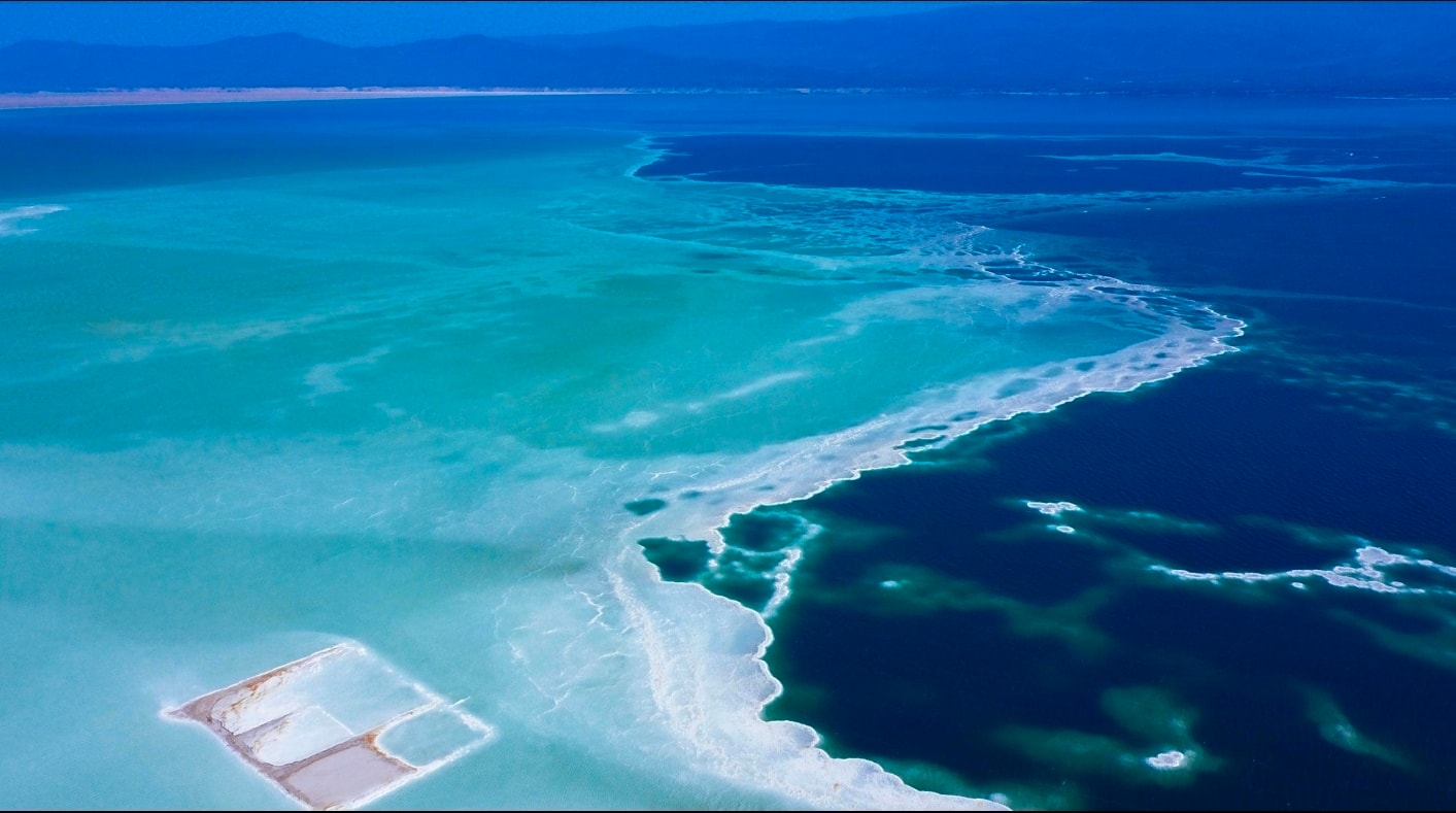 Aerial view of Lac Assal — turquoise hypersaline lake at Africa's lowest point